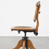 Antique late 19th century English office chair with reclining backrest and height adjustable