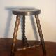 Round tripod stool with turned wooden legs