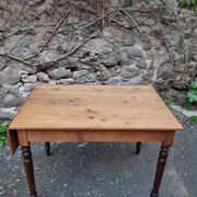 Vintage pine table with drop-leaf extension and turned beech legs, France, 1930s.