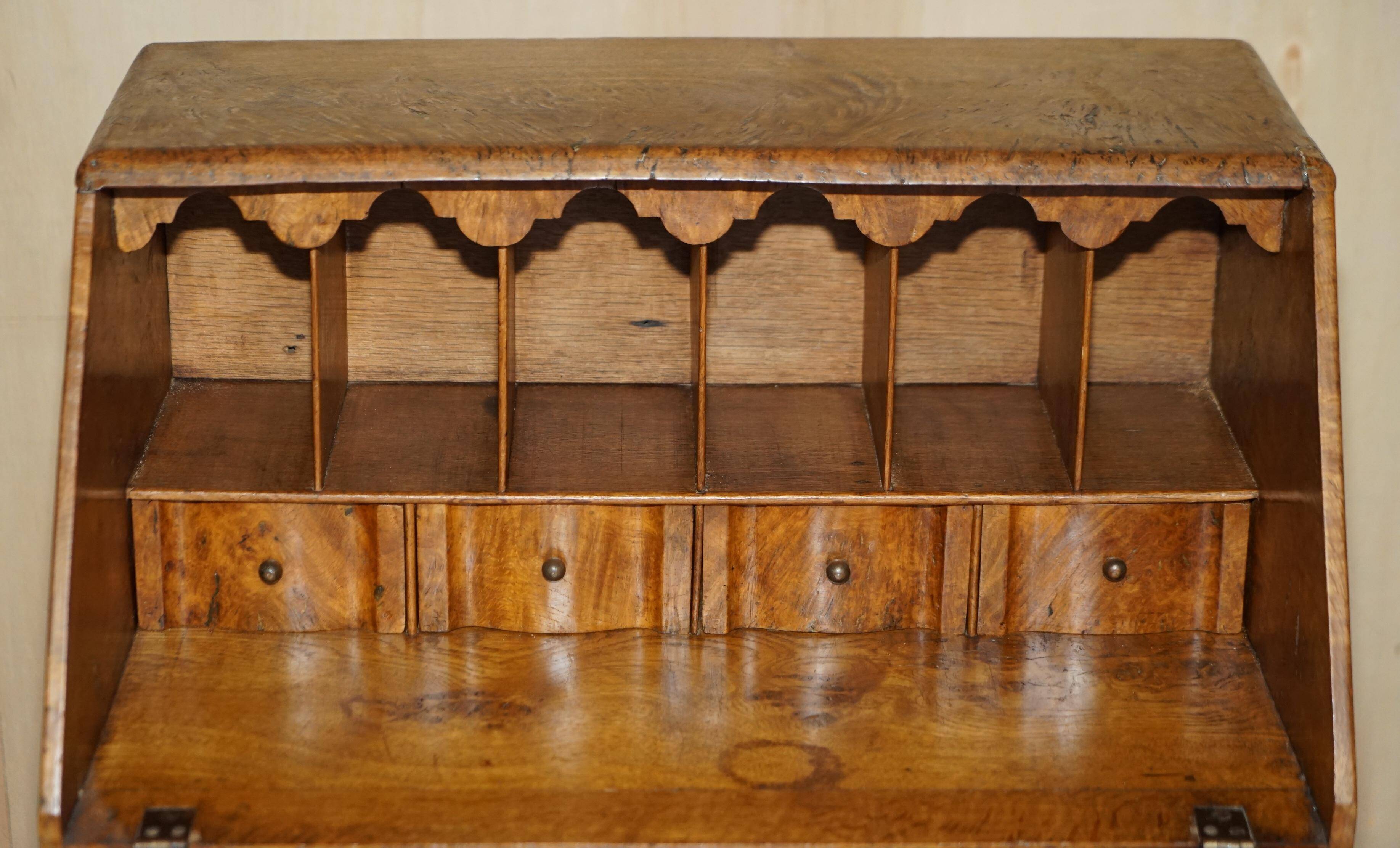 Writing desk in pollard oak from around 1800 with claw and ball carved legs.