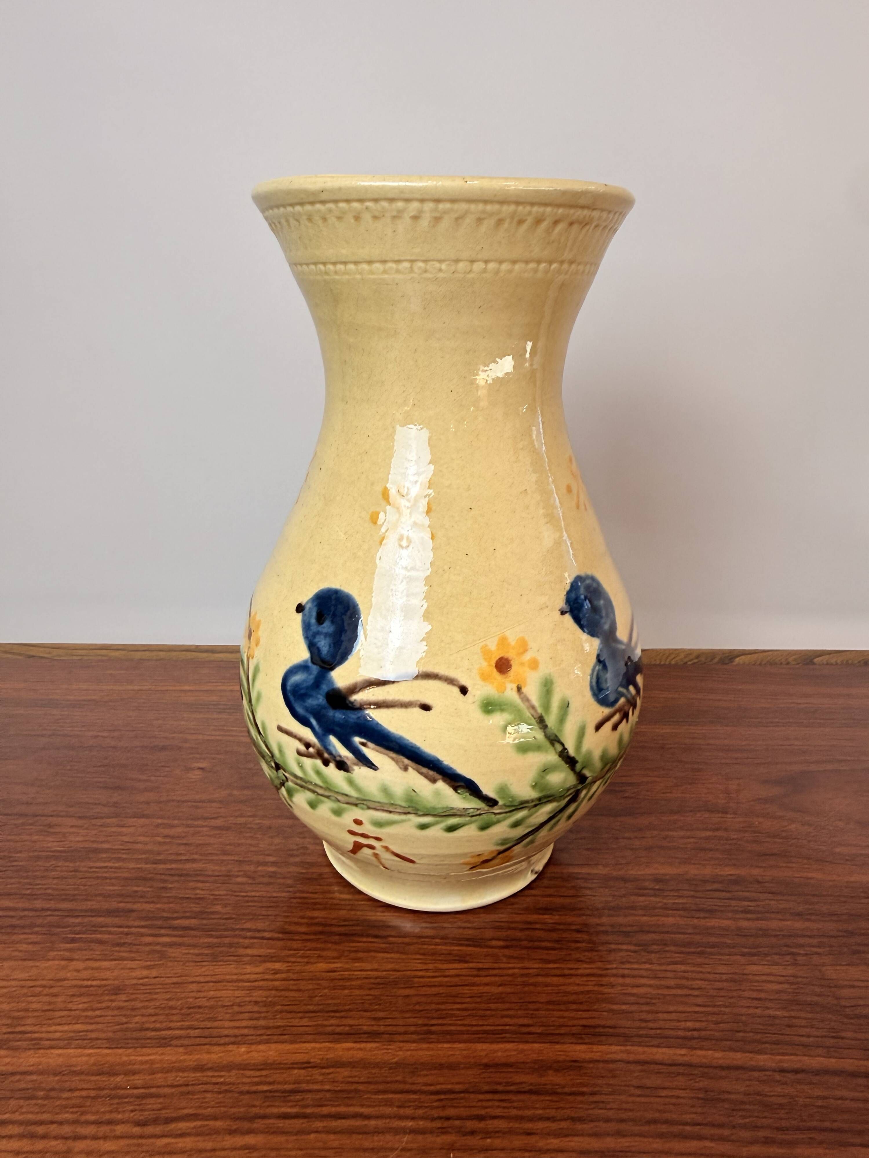 Large vase in glazed pottery decorated with blue birds and flowers.