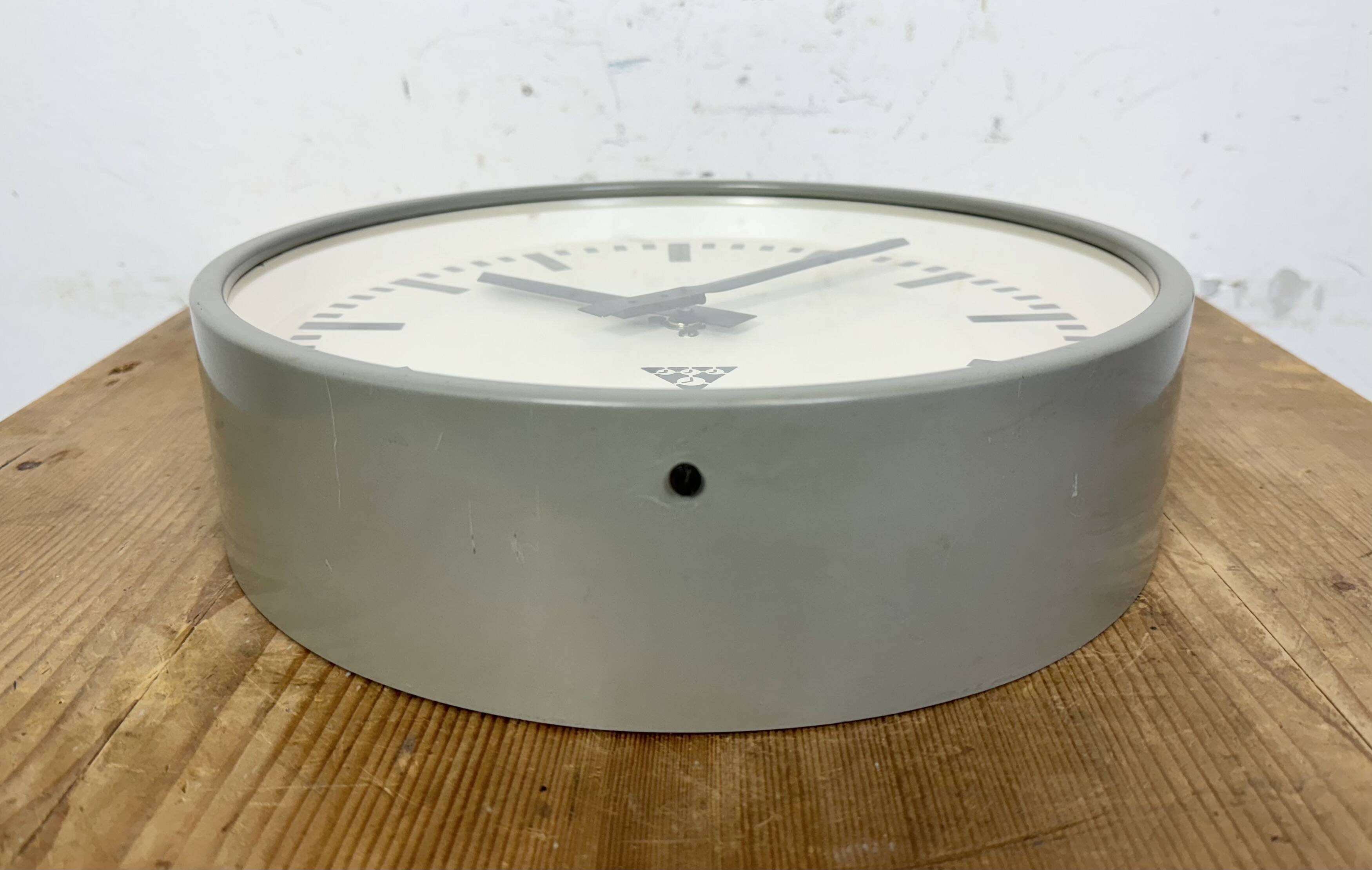 Industrial grey factory wall clock from pragotron, 1960s