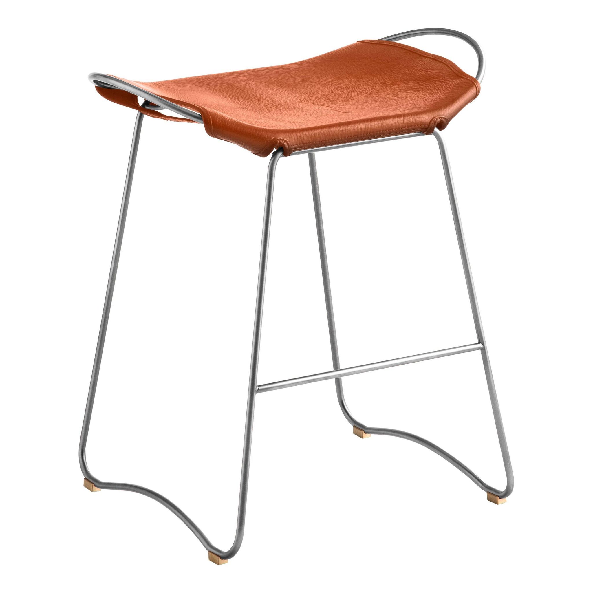 Contemporary bar stool with organic design in aged silver metal and natural tobacco leather.