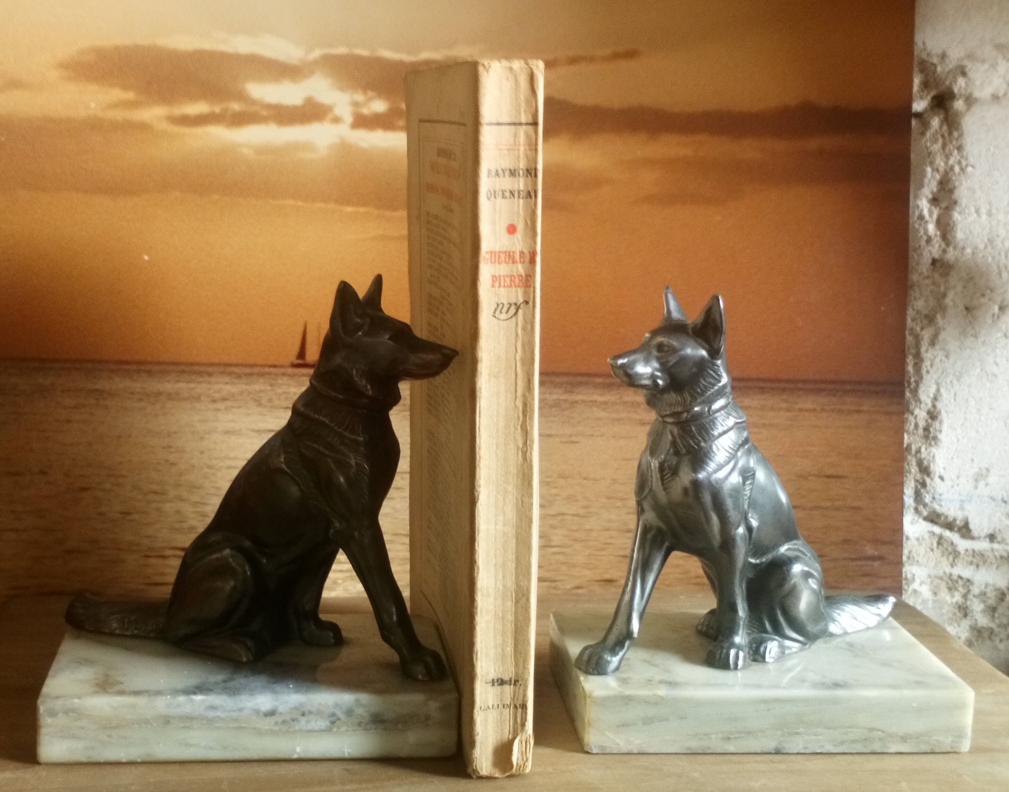 Pair of Art Deco bookends to signed wolf dogs
