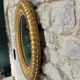 Pair of antique oval mirrors gilded with gold leaf and mercury.