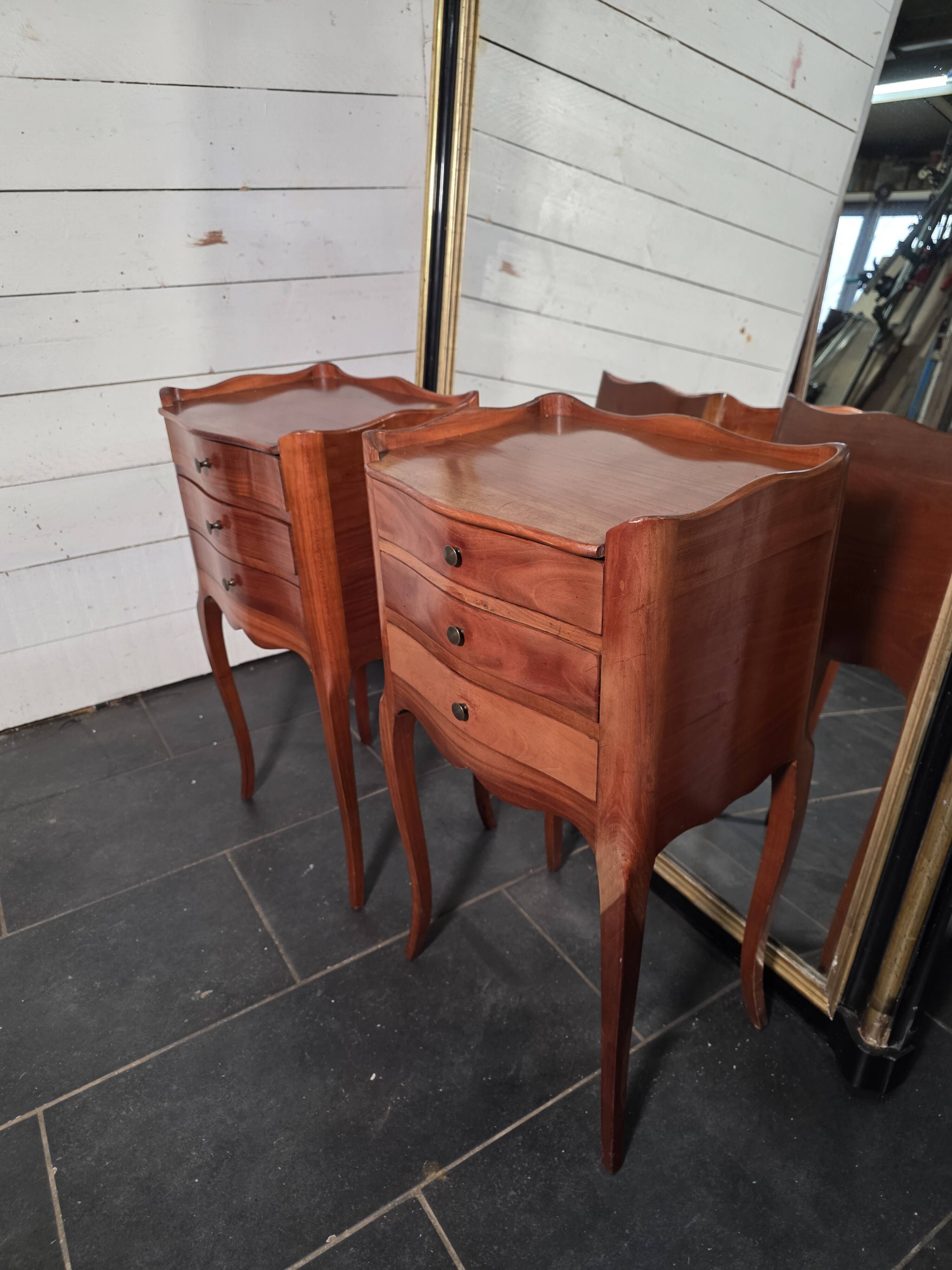 Pair of Louis XV style bedside tables in cherry wood.