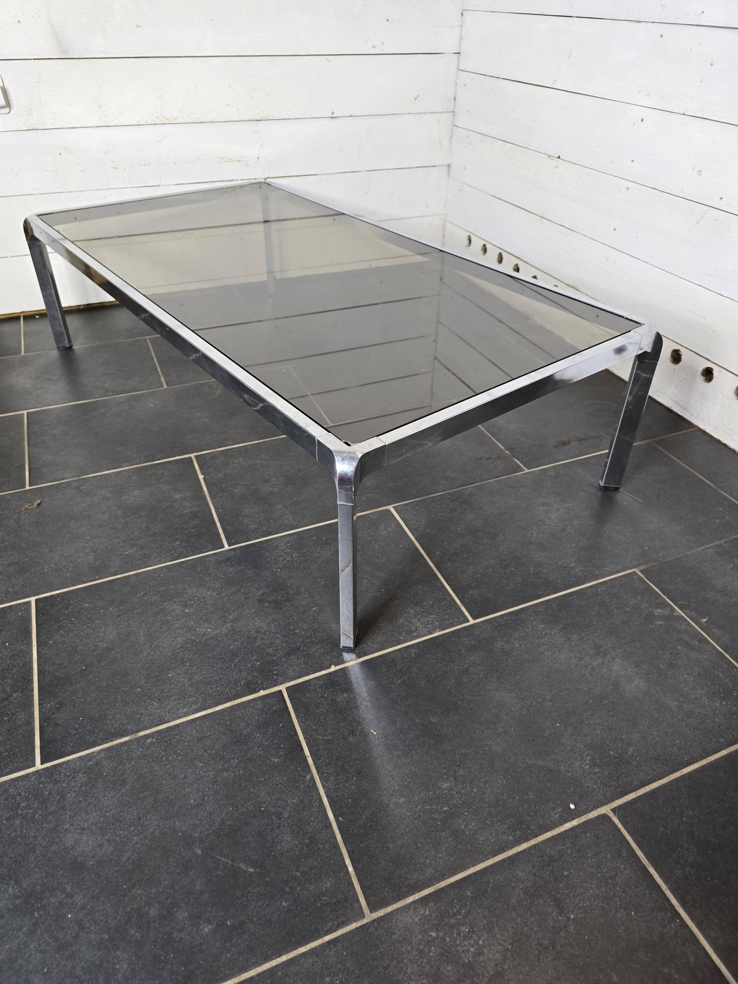 Chromed metal coffee table with smoked glass top from the 70s