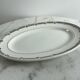 Oval presentation plate Saint Amand with bicolour floral decoration.