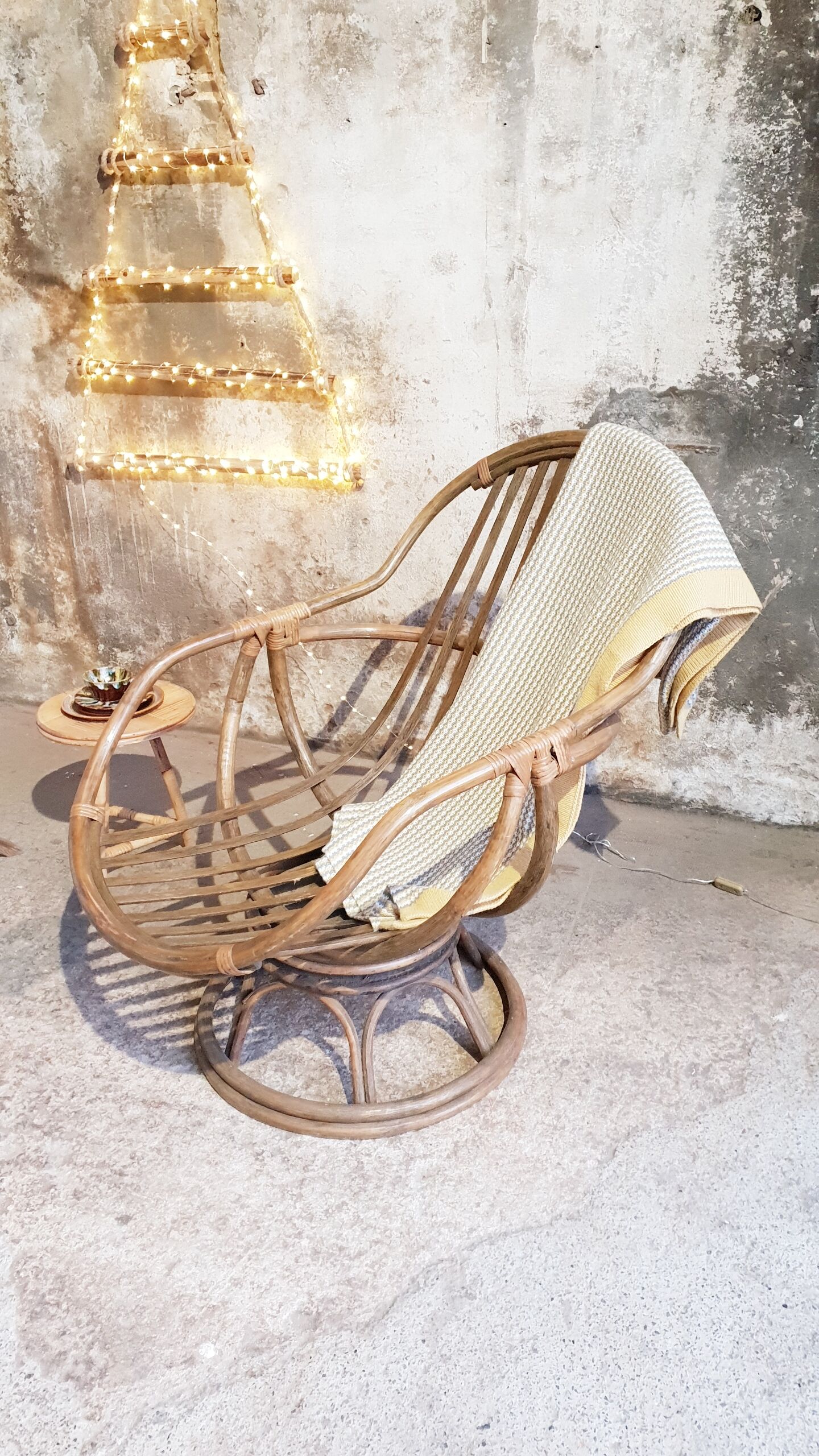 Antique swivel rattan armchair