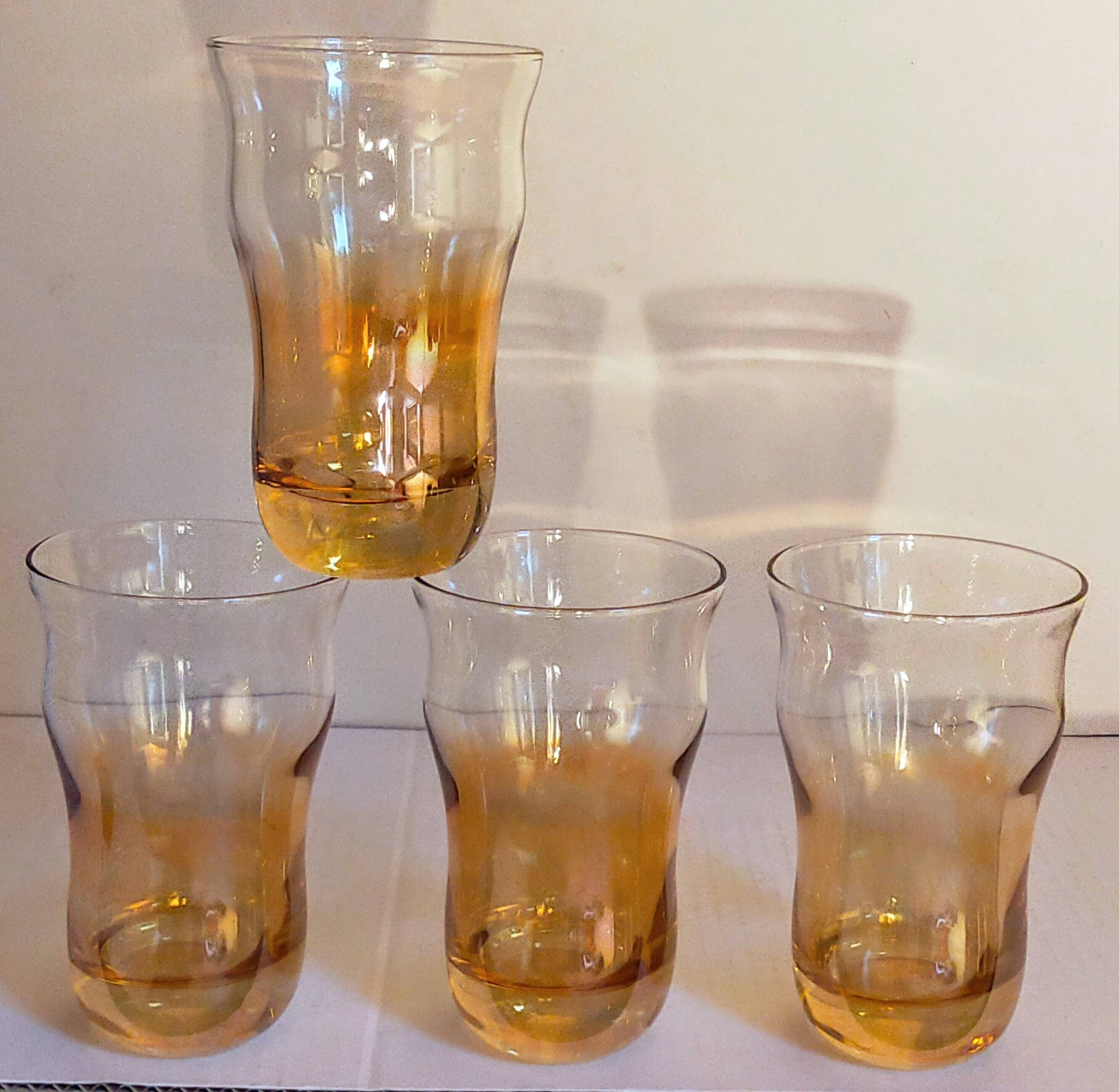 Four iridescent honey blown glass glasses