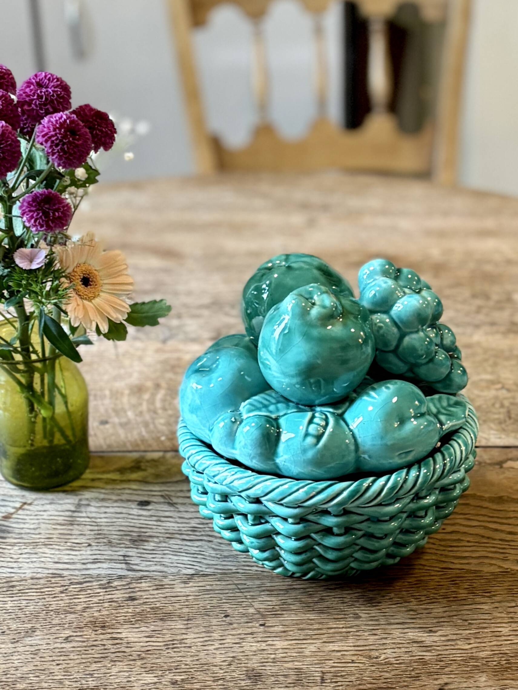 Vintage green earthenware plate/basket with fruit decorations.
