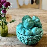 Vintage green earthenware plate/basket with fruit decorations.