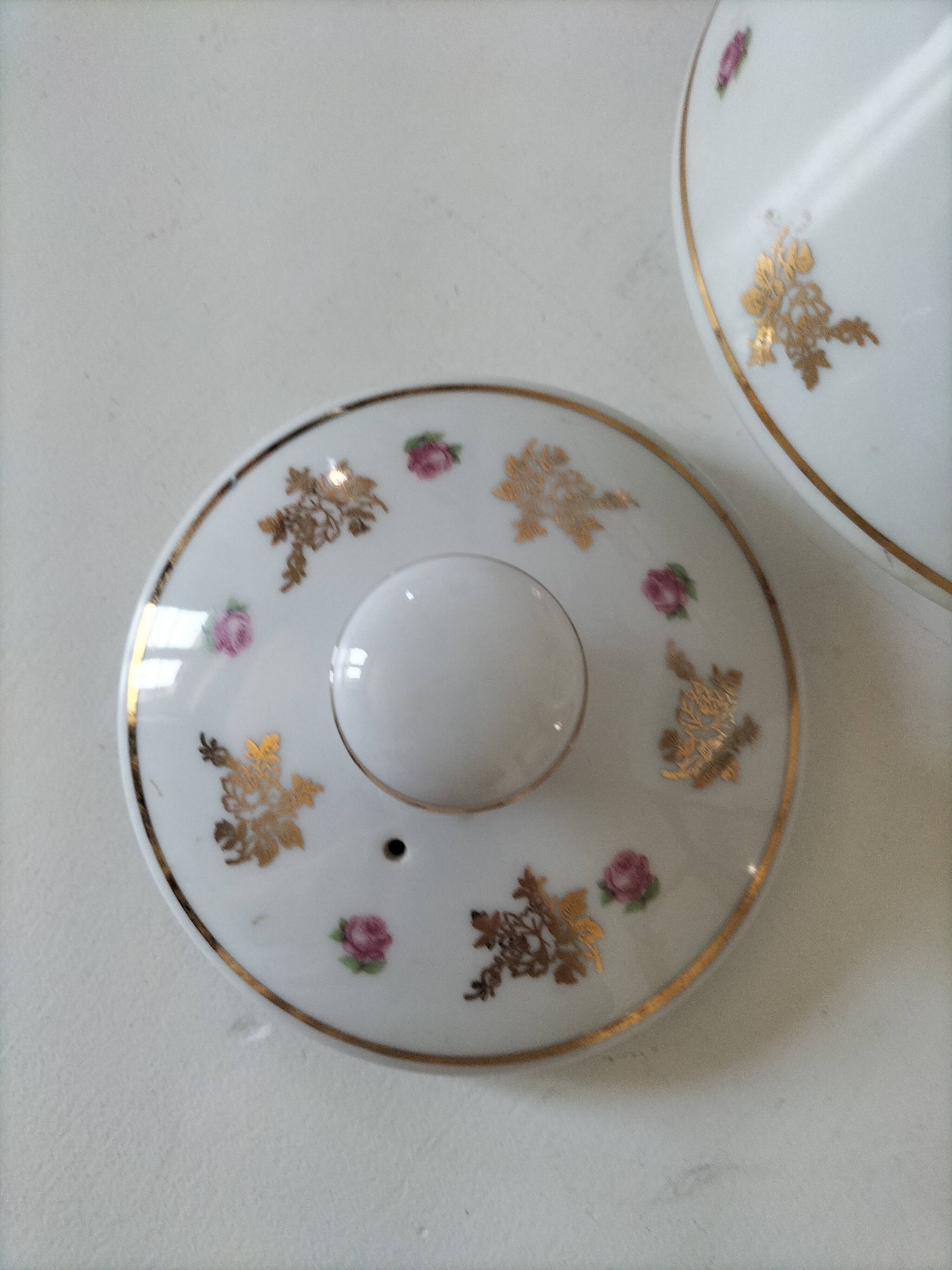 Porcelain teapot Louis Lourioux, decorated with roses and pyroluxe gilding.