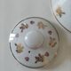 Porcelain teapot Louis Lourioux, decorated with roses and pyroluxe gilding.