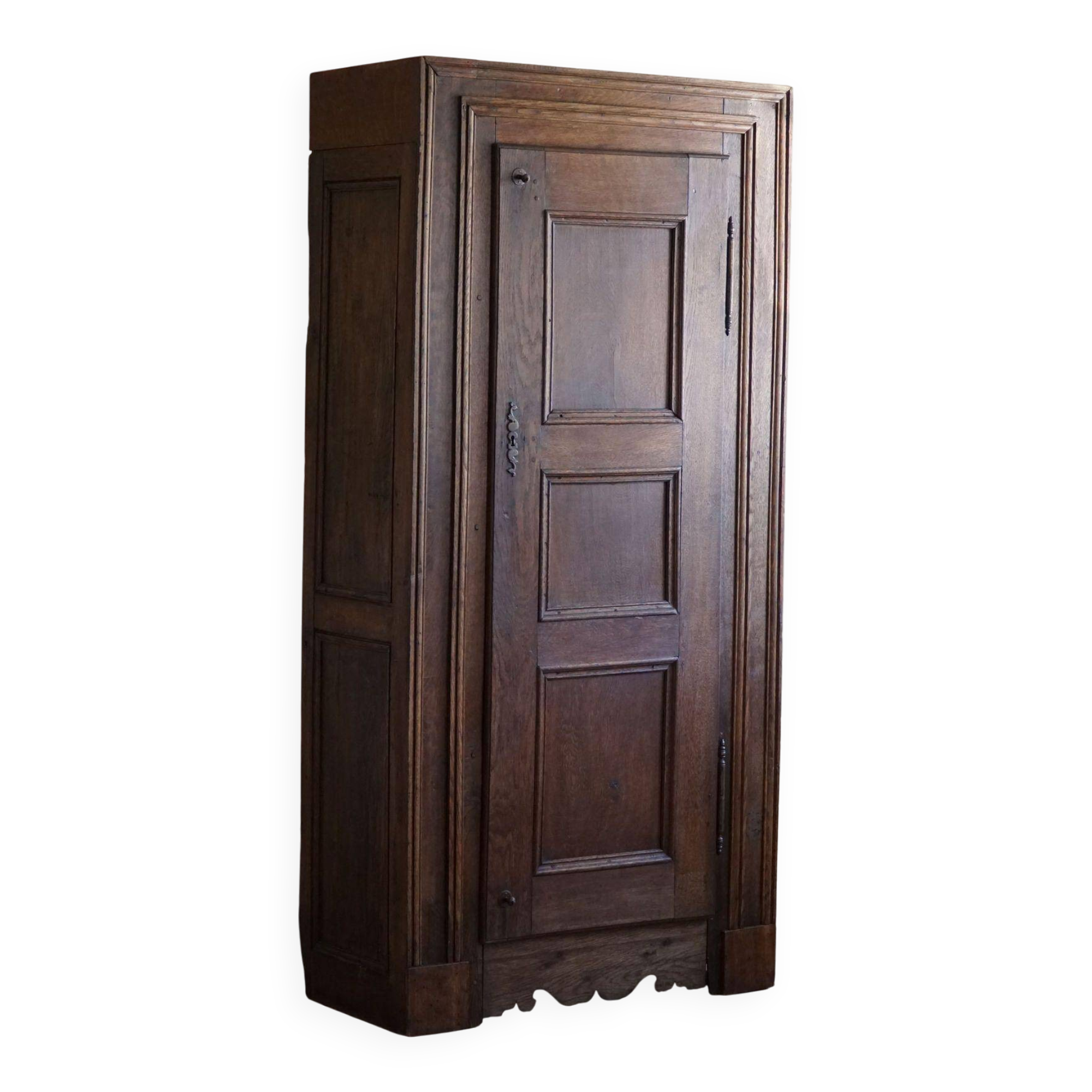 Tall antique oak wardrobe, made by a French cabinetmaker, late 19th century.