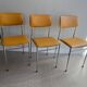 LM vintage chrome and orange/mustard yellow faux leather chairs