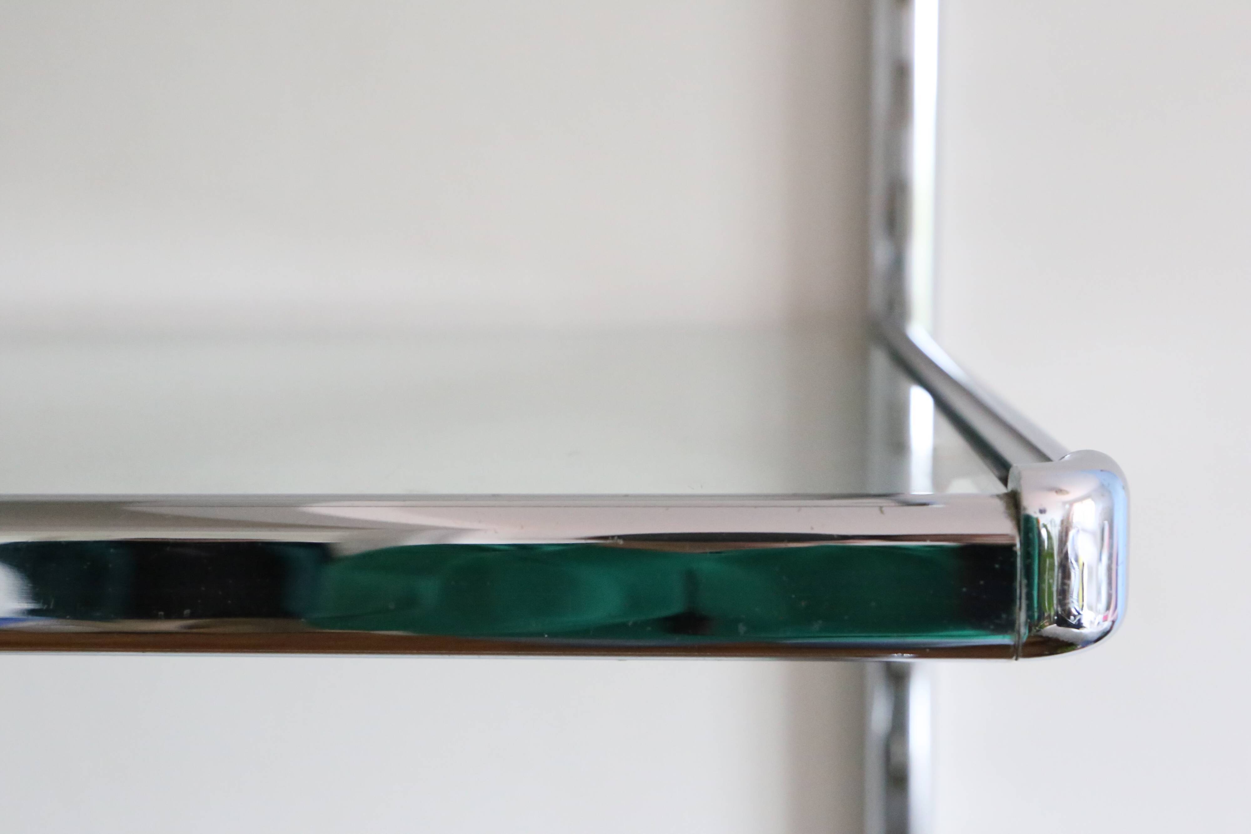 Chrome and glass wall shelf, circa 1960