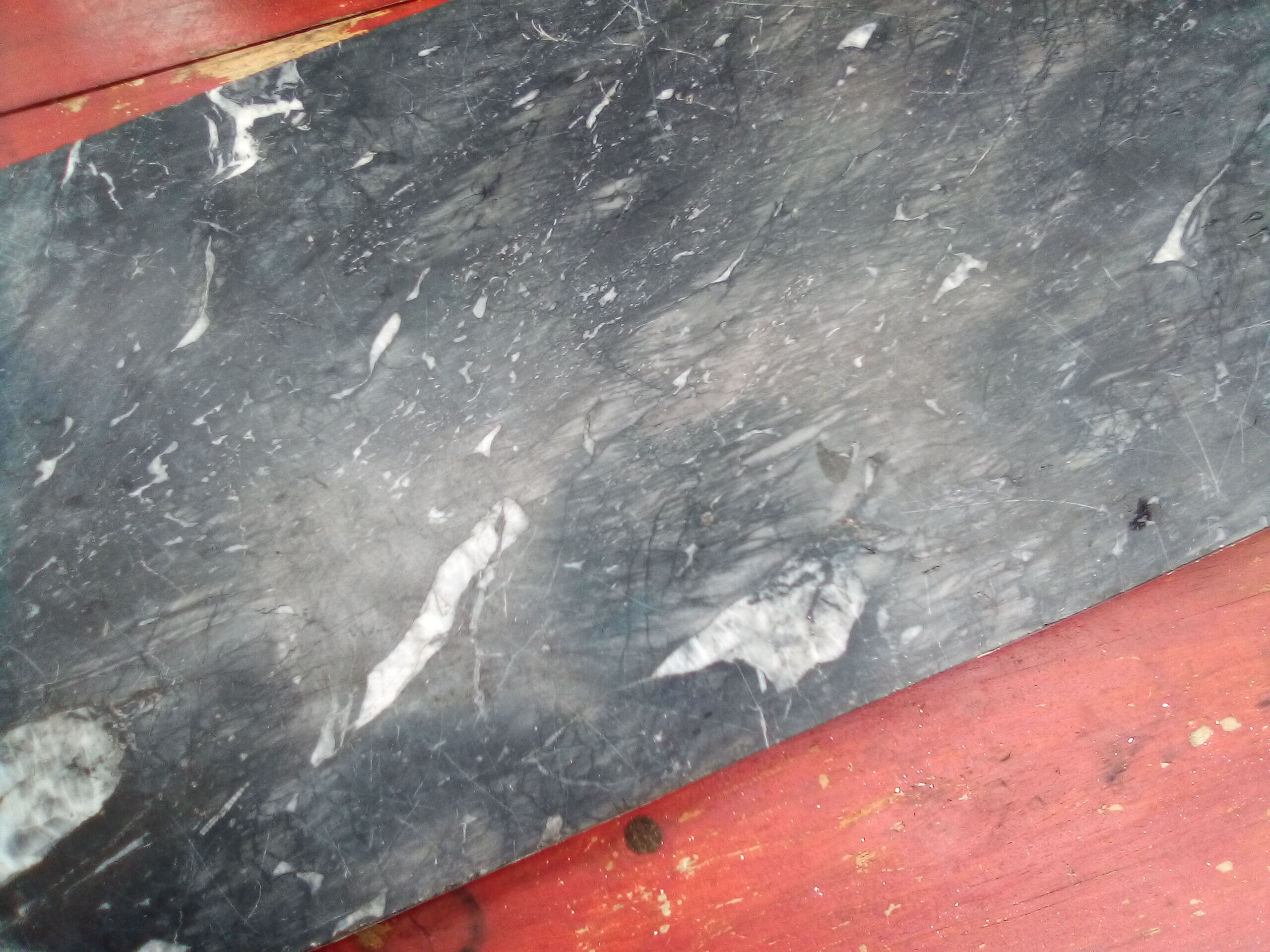 White veined black marble fireplace