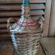 Dame Jeanne Bonbonne Bottle Touque bluish glass wicker Dp 1122414