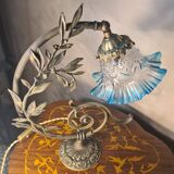 Bronze and brass lamp, transparent and blue glass shade.