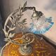 Bronze and brass lamp, transparent and blue glass shade.