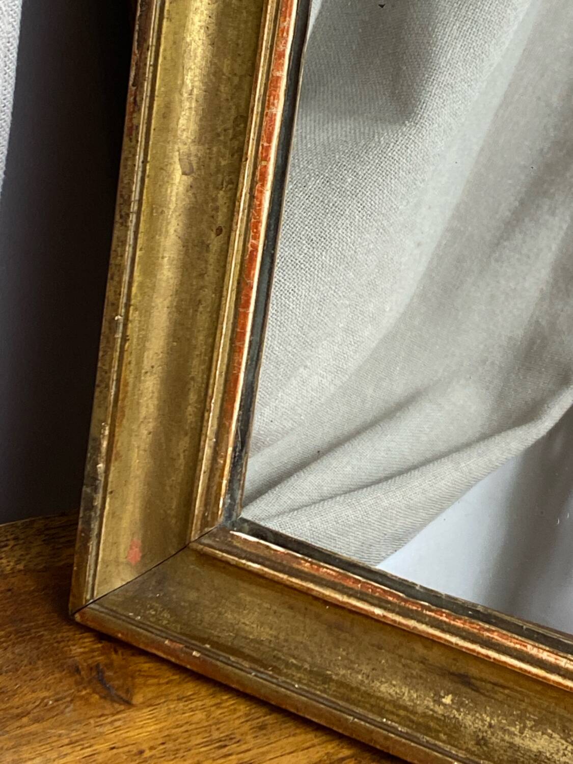 Antique mirror in gilded wood