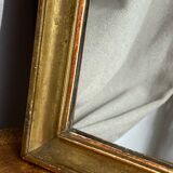 Antique mirror in gilded wood