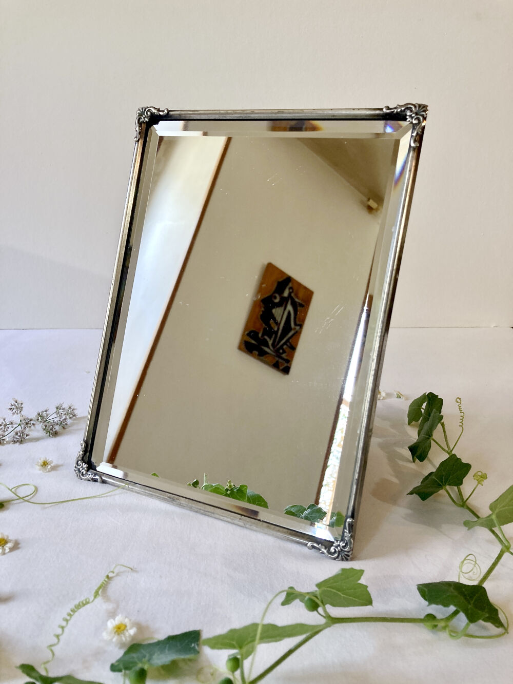 Antique framed mirror, bevelled glass and silver-plated metal frame, 1930-1940.
