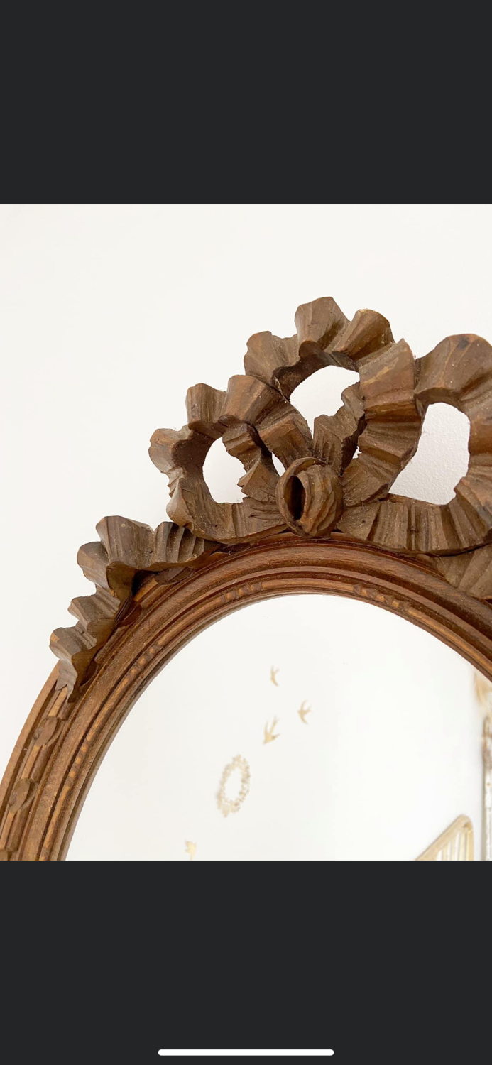 Louis XVI style oval knot mirror