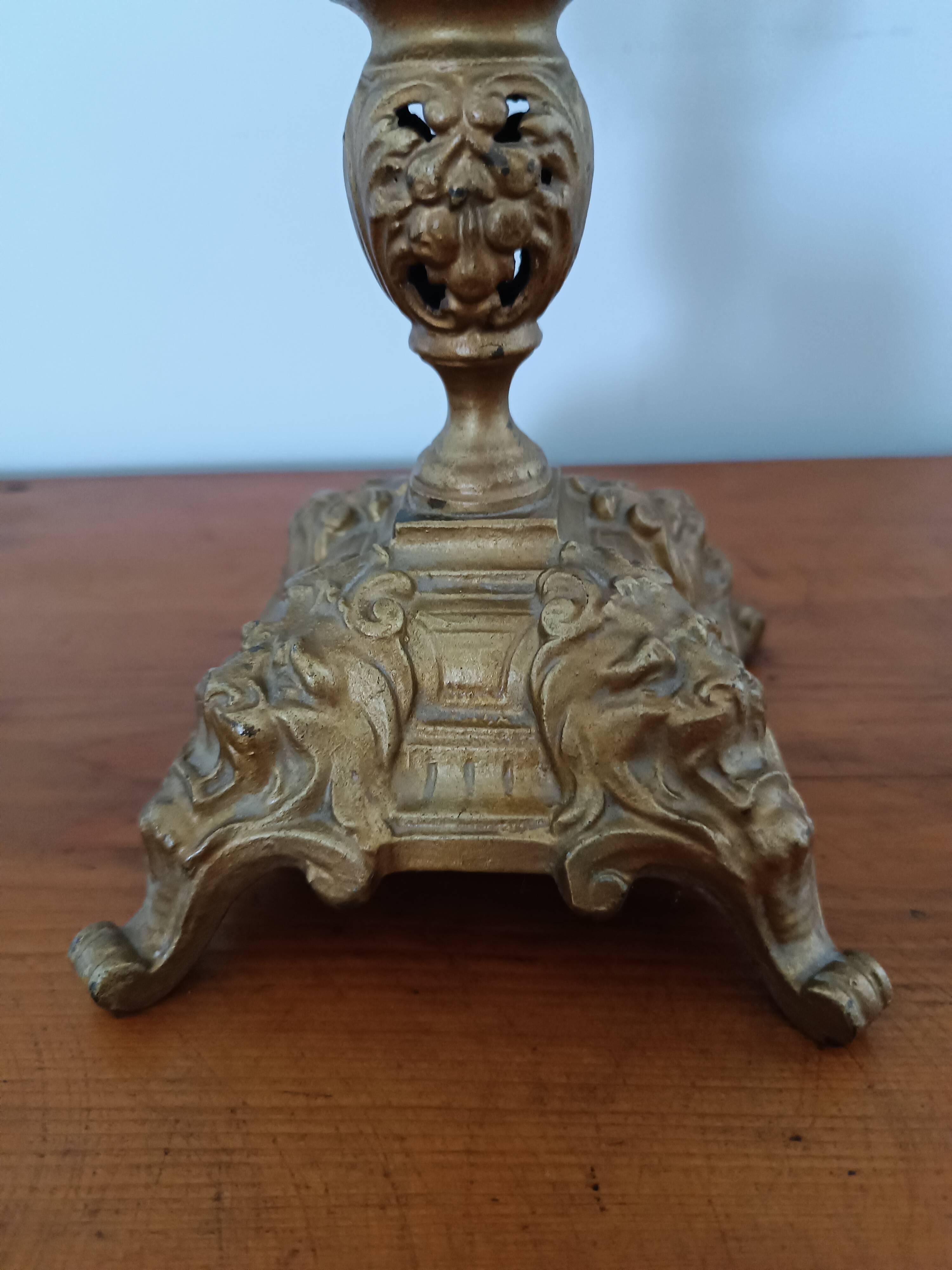 Bronze candlestick with lion head decoration