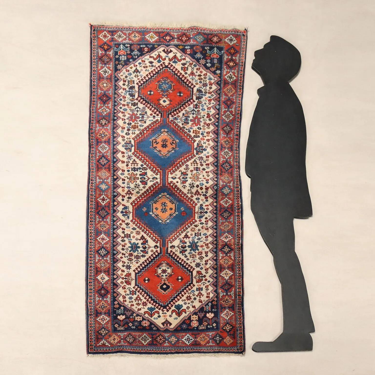 Ancient Asian wool rug, finely knotted, handmade 72 x 33 in.