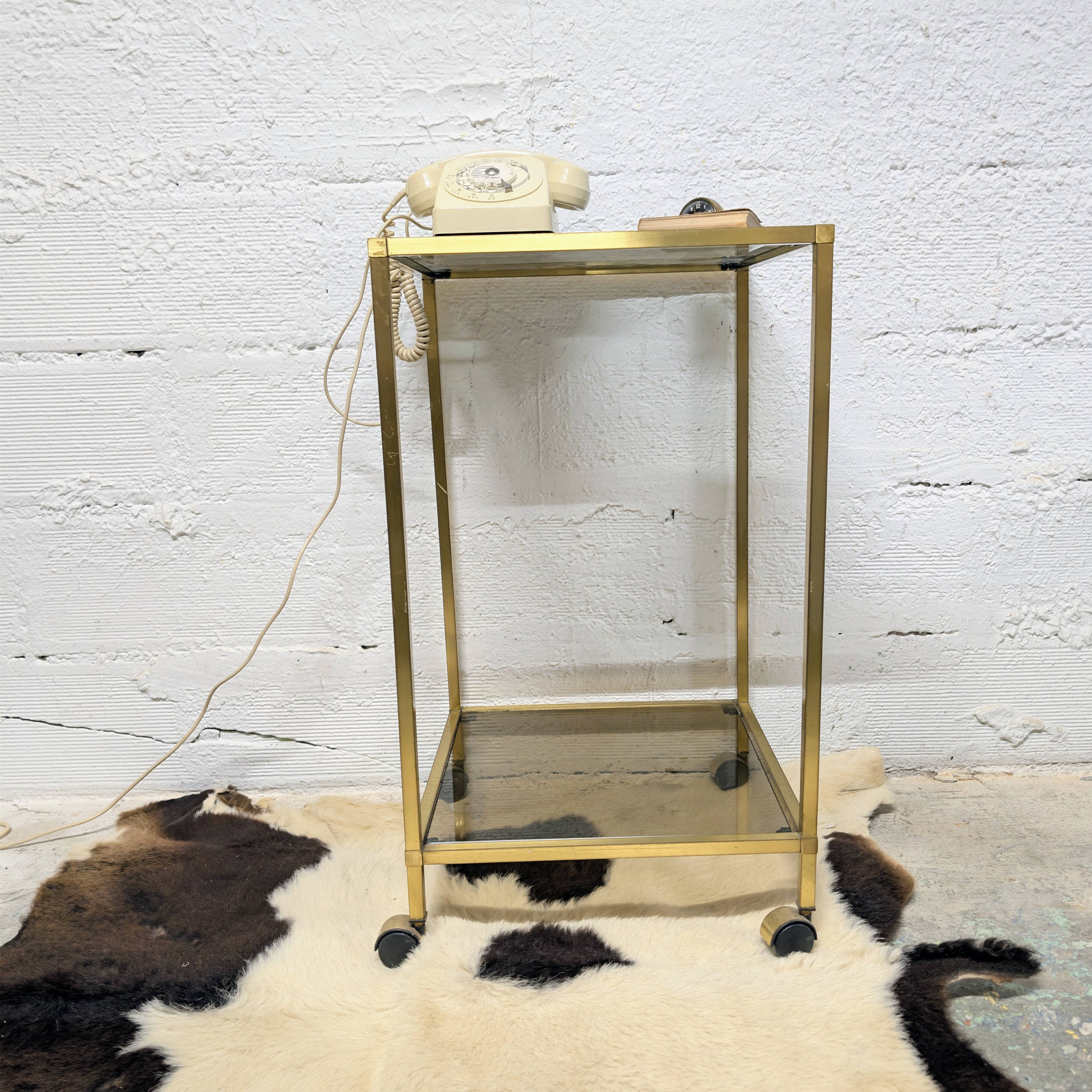 Vintage rolling table in brass and smoked glass