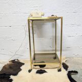 Vintage rolling table in brass and smoked glass
