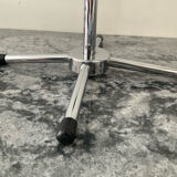 A pair of vintage side tables in glass and chrome metal.