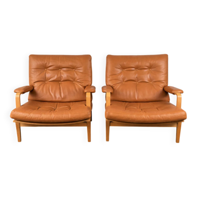 Paire de fauteuils Ingrid en hêtre et cuir par Bruno Mathsson pour Dux, fauteuils Ingrid, Danemark, 1960.