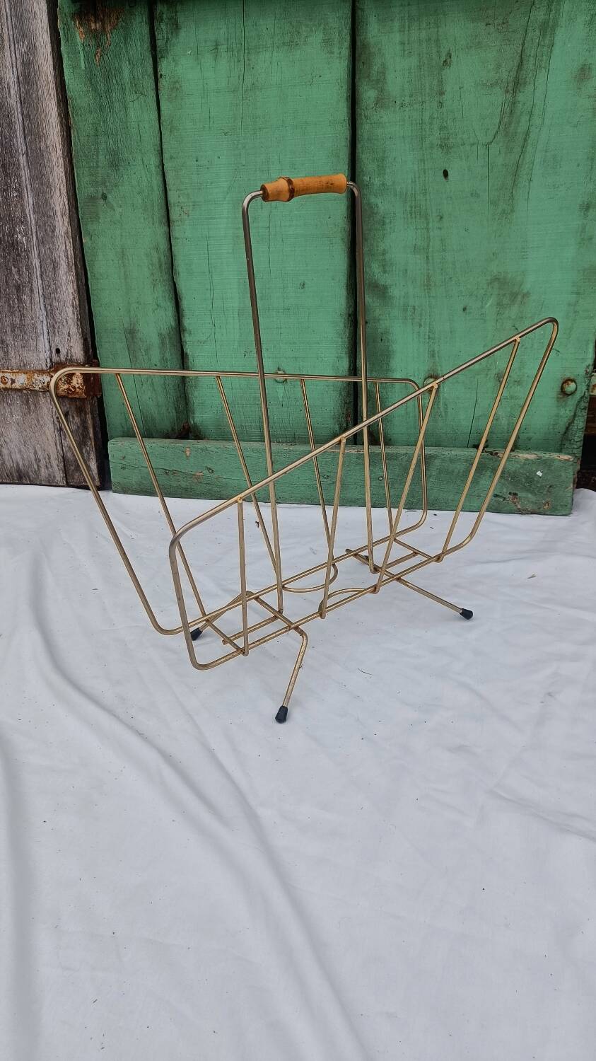Vintage magazine rack in golden brass