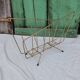 Vintage magazine rack in golden brass