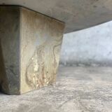 Light gray solid granite coffee table with organic triangular shape and conical base, 1980s