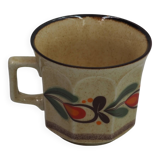 Speckled cup with flower pattern