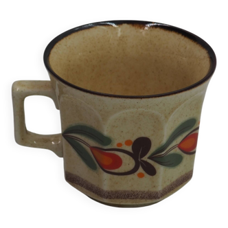 Speckled cup with flower pattern