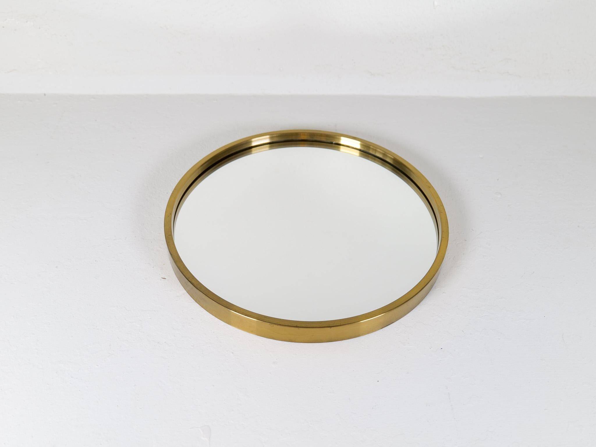 Round brass mirror from the mid-century by Glasmäster in Markaryd, Sweden, 1960s.