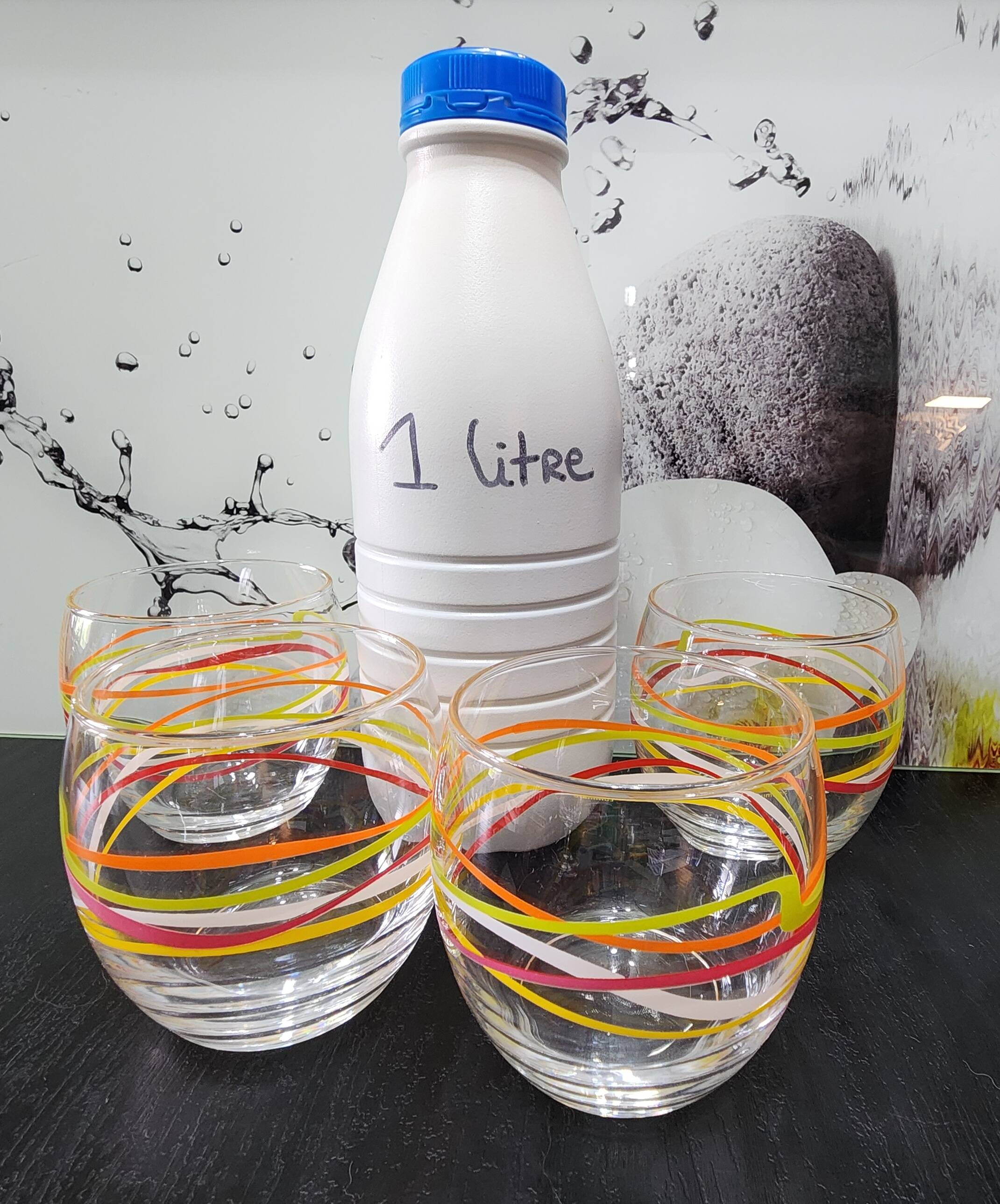 4 vintage Luminarc water glasses with coloured spiral line patterns.