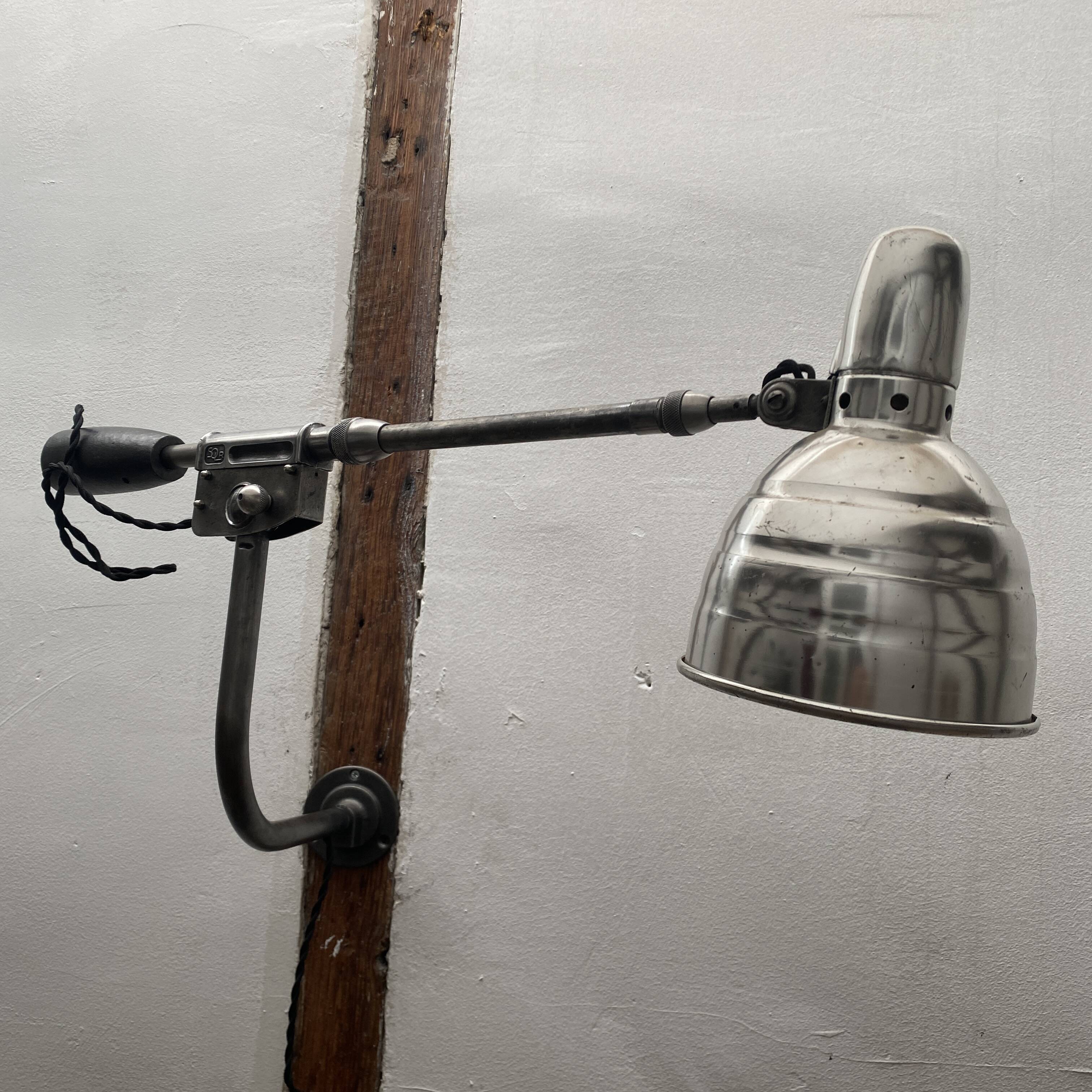 Old industrial wall light with counterweight.