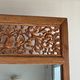 Very large freestanding teak mirror with an openwork carved pediment, Indonesia.