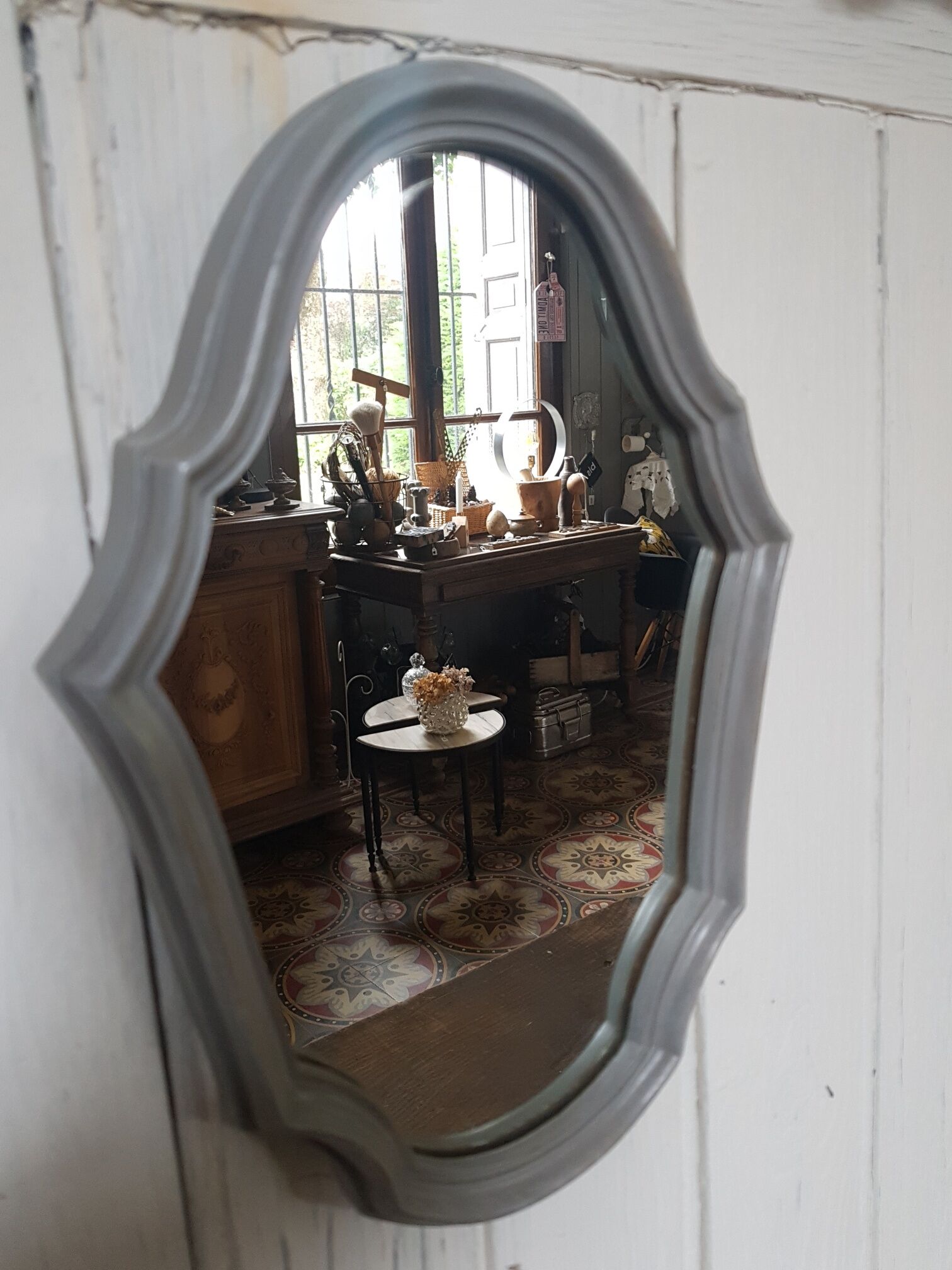 Grey patinated baroque mirror