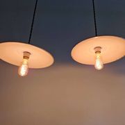 Trio of large industrial suspensions in green enamelled sheet metal.