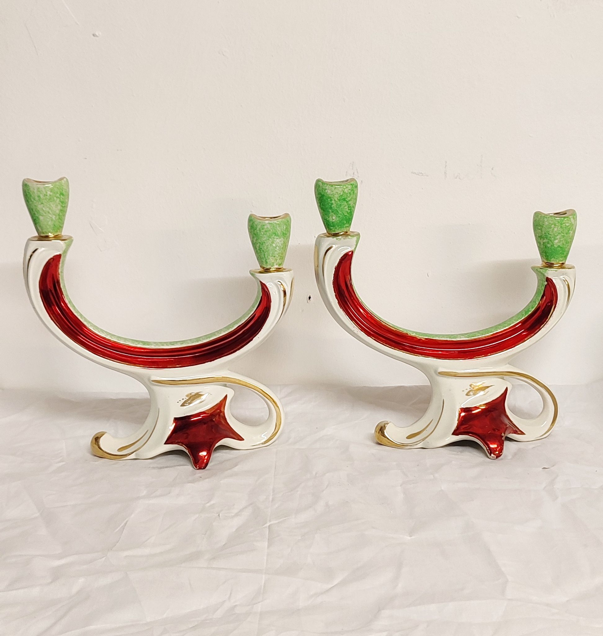 Painted ceramic chandeliers. France, 1950s.
