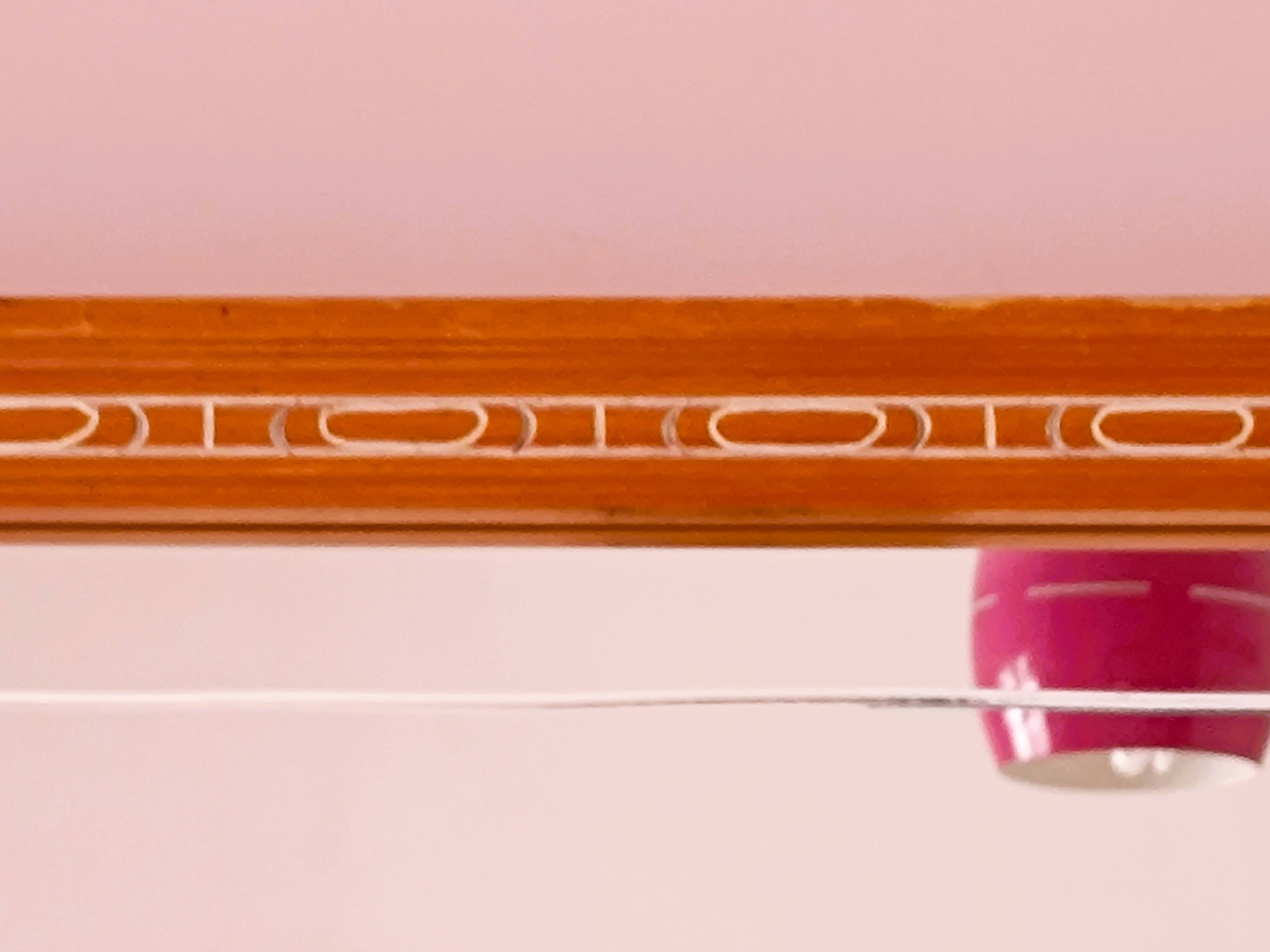 Beveled glass wall mirror in solid wood frame