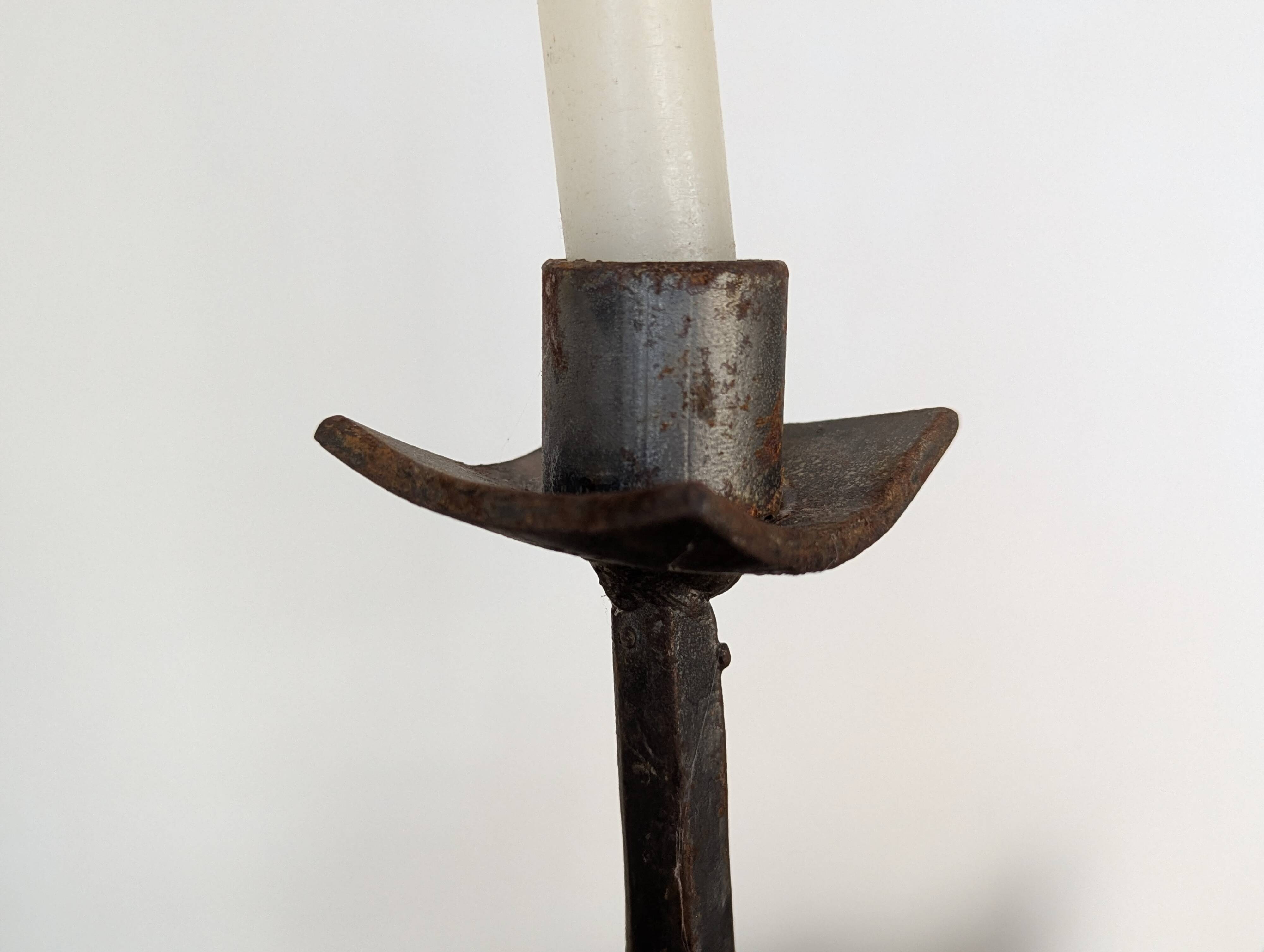 Pair of wrought iron candlesticks