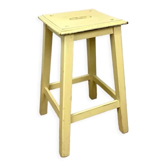 Workshop stool with yellow slot